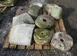 A PALLET OF ASSORTED GRANITE ITEMS, including old grinding stones, sections of pillar caps, etc. (