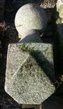 A PAIR OF CARVED GRANITE CORNICE FINIALS, each with a ball top, 24in (61cm). (2)