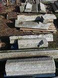 ELEVEN EARLY CUT GRANITE MOULDINGS,
various sizes and shapes, contained on three pallets. (11)