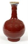 A CHINESE SANG DU BOEUF BOTTLE VASE, 
of bulbous form, with double-gourd neck and flared top,