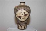 AN UNUSUAL CHINESE STONEWARE BALUSTER VASE, 
decorated with stylised birds with brown decoration.,