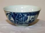 A CHINESE BLUE AND WHITE BOWL, 
decorated with an all-around scene with children, double blue circle