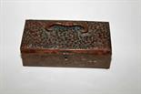 A RECTANGULAR JAPANESE BRONZE JEWELLERY BOX 
with bat-shaped swing handle, the top with flowers in