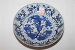 A CHINESE BLUE AND WHITE DISH, 
decorated with flowers and scrolling foliage, six-character mark