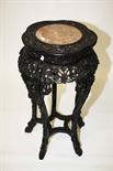 A GOOD QUALITY CARVED CHINESE CHERRYWOOD JARDINIERE STAND,
the shaped top with a circular marble