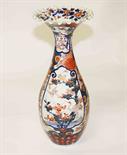 A 19TH CENTURY JAPANESE IMARI VASE of baluster form, under a flared and ripple neck, decorated