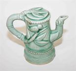 A CHINESE GREEN CRACKLEWARE TEA POT FORM WATER DROPPER, 
with bird and bamboo in relief, 6in (15cm).