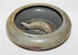 A CHINESE GLAZED STONEWARE BOWL, 
the inside depicting a carp in high relief, 7in (18cm). (1)