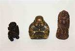 A SMALL BRASS FIGURE OF A BUDDHA,
3.5in (9cm), a small wooden figure of a Buddha and an amber type