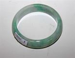 A LIGHT GREEN JADE BANGLE, 
3in (8cm). (1)