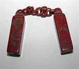 A PAIR OF CHINESE BLOOD STONE SEALS ON A CHAIN.
(1)