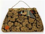 A CHINESE PIERCED GILT METAL COVERING BAG, set with jade and coral on a pierced band, the tapestry