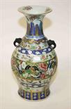 A 19TH CENTURY CANTONESE PORCELAIN VASE, of baluster form, with two stylised elephant mask