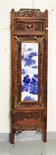 A CHINESE CARVED AND PIERCED HARDWOOD FOUR FOLD SCREEN, each leaf inset with a vertical blue and