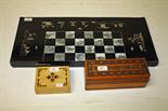 A CHINESE BLACK LACQUERED AND MOTHER O' PEARL INLAID CHESS AND BACKGAMMON BOARD, 
together with a