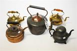 A LARGE OLD COPPER KETTLE, a small copper kettle, two brass kettles, a copper pint measure and a