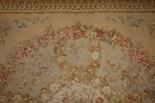 AN AUBUSSON STYLE PETIT POINT CARPET OR WALL HANGING, 
with large colourful circular floral