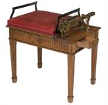 A GOOD OAK AND BRASS MOUNTED JOCKEY SCALES, 
with red hide coloured sprung padded seat, with side