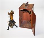 A BRASS AND STEEL LABORATORY MICROSCOPE, 
by E Leitz Wetzlar, in a wooden case with various