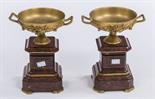 A PAIR OF UNUSUAL GILT BRASS AND  ROSA VERONA MANTLE PIECE URNS, 
each urn with two handles and