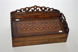 AN UNUSUAL VICTORIAN WALNUT TABLE TOP WRITING BOX, 
with open fret work gallery, and parquetry