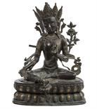 A TWO COLOUR BRONZE FIGURE, 
The Buddha Sakyamuni, with intricate tiara, seated on a lotus pillow,