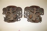A PAIR OF CARVED BURMESE HARDWOOD WALL BRACKETS,
early 20th century, each modelled as a masked