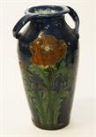 A TALL  DARK BLUE ENGLISH  VASE, probably Bretby , with two handles and chased with flowers, 19.