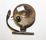 A BRASS MALOCK'S PATENT BRASS FISHING REEL, 
3.25in (8cm)d. (1)