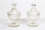 A PAIR OF LATE 19TH CENTURY CUT GLASS SWEET MEAT URNS 
and covers, each with a mushroom finial on