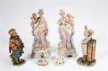 AN ITALIAN BISQUE FIGURE
depicting a physician, 12in (31cm); a pair of tall early 20th century