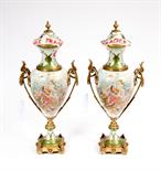 A PAIR OF SEVRES STYLE PORCELAIN AND BRASS MOUNTED VASES AND COVERS, 
each with two leaf cast