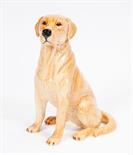 A BESWICK CERAMIC FIGURE OF A SEATED GOLDEN LABRADOR, 
13.5in (34cm). (1)