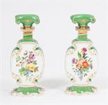 A PAIR OF LATE 19TH CENTURY GREEN AND WHITE PORCELAIN FLASKS, 
each with a scroll shaped stopper and