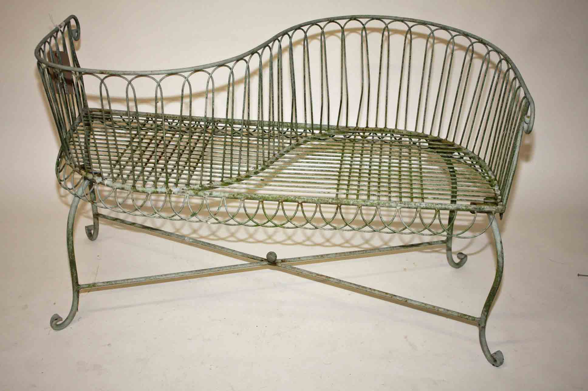 A Wrought Iron Two Seater Conversation Garden Bench S Shape On