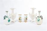 A GOOD PAIR OF VICTORIAN MILK GLASS VASES, 
each decorated with a crane on a riverbank, on four gilt