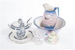 A BLUE AND WHITE SOUP TUREEN, LADLE AND STAND, 
with armorial crest; together with a pink and dark