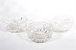 A CUTGLASS FRUIT BOWL, 
probably Waterford, 8in (20cm)d; together with two other similar. (3)