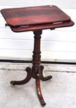 A 19th century mahogany adjustable reading table, the rectangular top rising with an angled