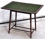 An Edwardian mahogany swivel action card table.