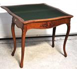 An early twentieth century fold over card table on cabriole legs, length 82cm.