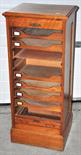 An Edwardian oak tambour fronted filing cabinet with nine internal sliding compartments (af), 48 x