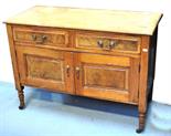 An Edwardian walnut wash stand with two drawers over two doors, 77 x 102cm.