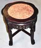 A carved Chinese hardwood jardinière stand with a rouge marble insert on claw feet, height 46cm.