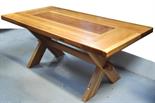 A contemporary John Lewis oak and walnut refectory table raised on X framed supports, 180 x 90cm.