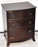 A small reproduction bowfront chest of three drawers, 78 x 63cm.