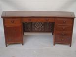 A Chinese carved rosewood twin pedestal desk. 
With fan shaped top over an arrangement of drawers