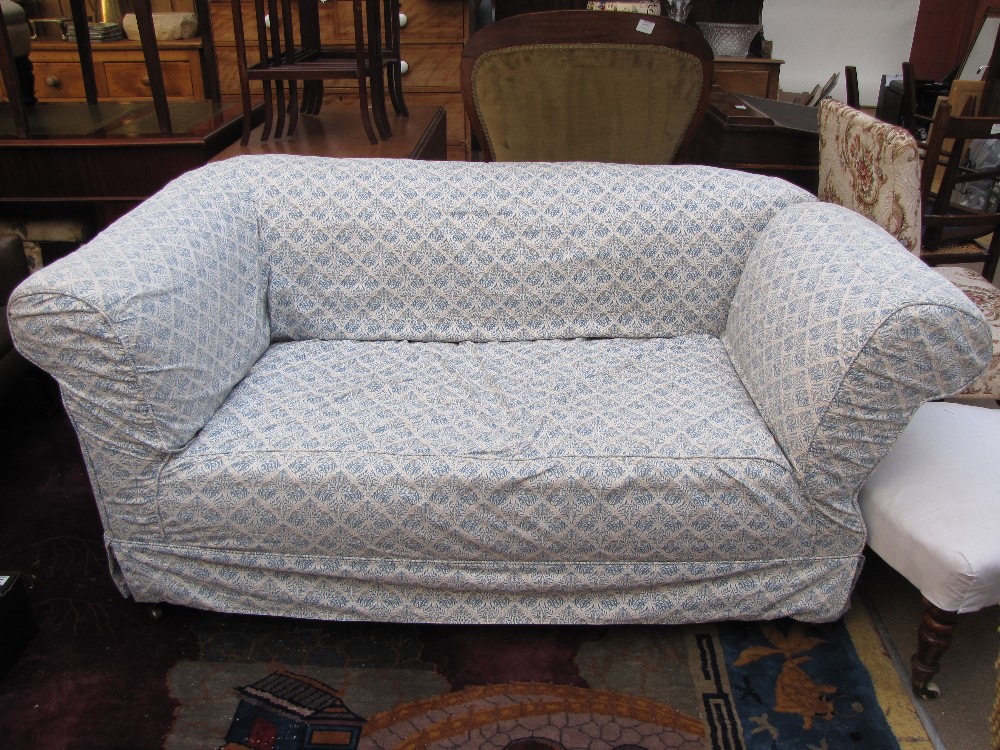 An Edwardian drop end Chesterfield sofa with William Morris design