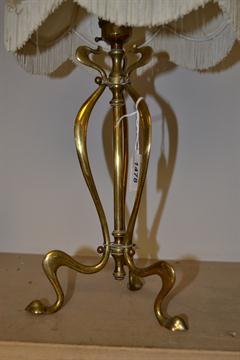 An Art Nouveau brass table lamp of An Art Nouveau Brass Table Lamp With An