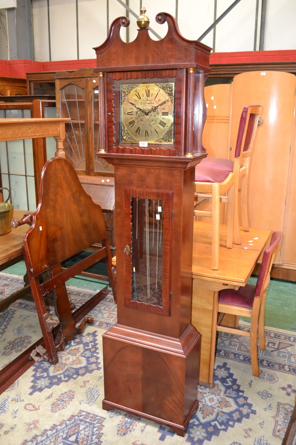 A reproduction mahogany longcase clock, stamped E.J. Goodfellow